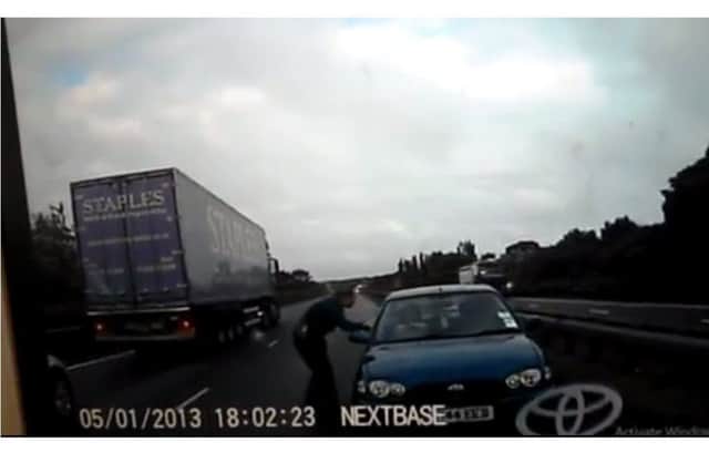 Off duty PCSO Sallie Lunness tries to stop Tahir Khalil after he pulled a U-turn on the Fletton Parkway