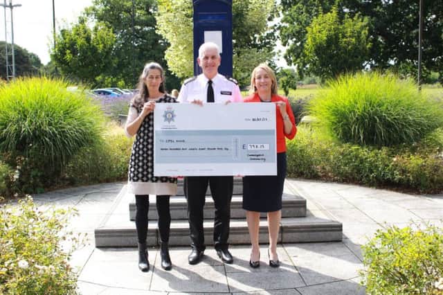 Chief Constable Alec Wood makes the presentation to Jo Fitzpatrick, Blue Light Wellbeing Community Developer, and Jenny Swain, Blue Light Network Coordinator, from Cambridgeshire, Peterborough and South Lincolnshire (CPSL) Mind