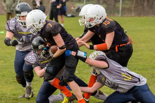 Ladies playing American Football.