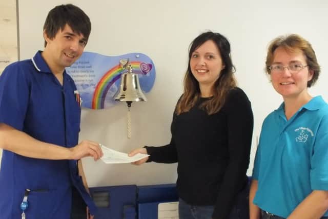 Danielle Carver and Jane Squirrel presenting the cheque.