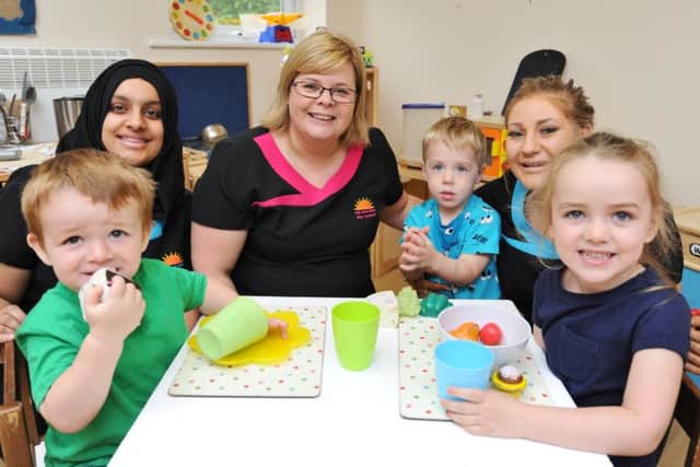 Rise and Shine Day Nursery, Netherton, is now staying open following threat of closure from the landlords. Pictured are children Edison O'Leary, Emelia O'Leary and Finn Nespoli with staff Irsa Jabeen, owner Alison Holmes and Katie Peppiatt EMN-170724-143841009