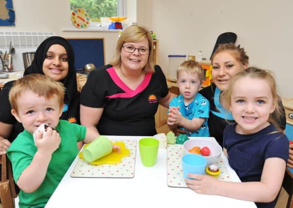 Rise and Shine Day Nursery, Netherton, is now staying open following threat of closure from the landlords. Pictured are children Edison O'Leary,  Emelia O'Leary and Finn Nespoli with staff Irsa Jabeen, owner Alison Holmes and Katie Peppiatt EMN-170724-143841009