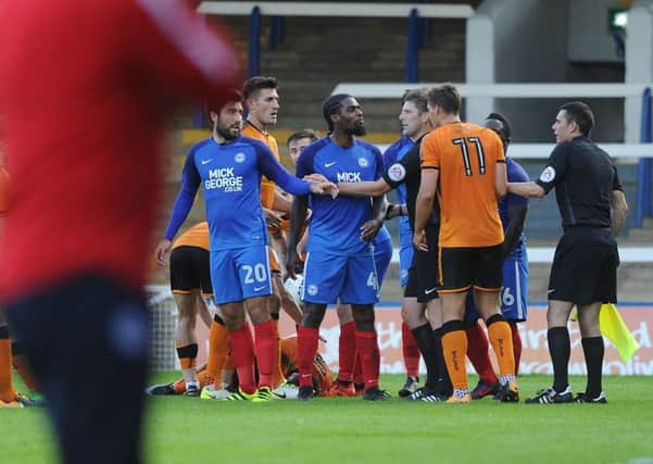 A flare-up between Posh and Wolves players after a poor Gwion Edwards challenge. Photo: David Lowndes.