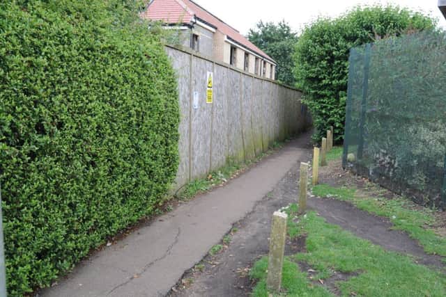 The passageway next to Yaxley Library running from Landsdowne Road to Middletons Road recreation ground EMN-170726-170405009