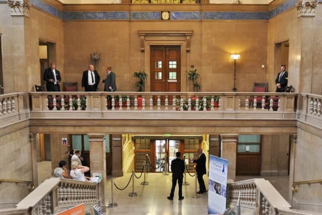 Security and council staff inside the Town Hall
