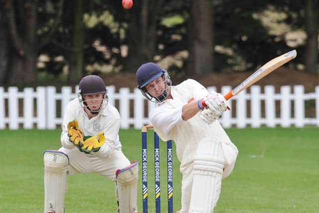 Sam Evison smacks a six for Bourne at Market Deeping. Photo: David Lowndes.