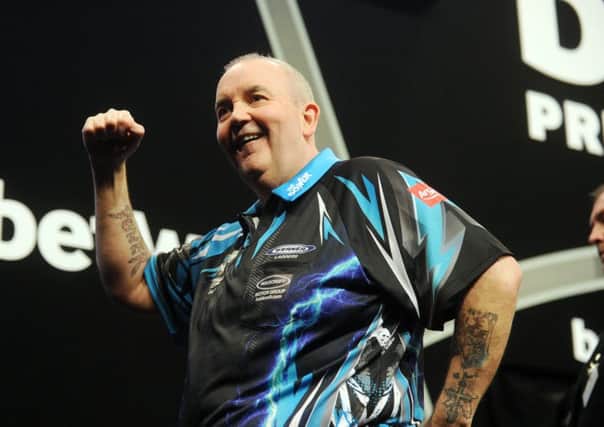 Phil Taylor celebrates another win.