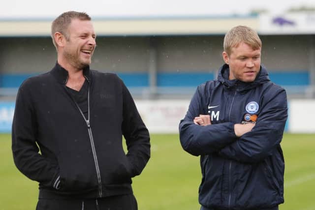 Posh chairman Darragh MacAnthony (left) and manager Grant McCann.