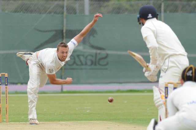 Jamie Smith bowling for Peterborough Town against Old Northamptonians.