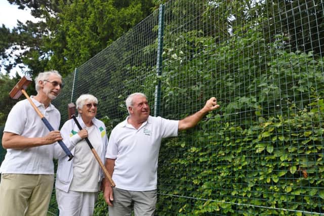 New fencing installed at Central Park around the bowls and croquet greens. Graham Harris, Roz Wright and Phillip Makepeace inspect the work. EMN-170108-124130009