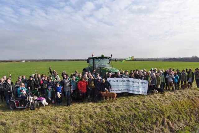 Castor, Ailsworth and Upton residents gather at the proposed development site 200meteres from Castor Hanglands EMN-170215-161941009