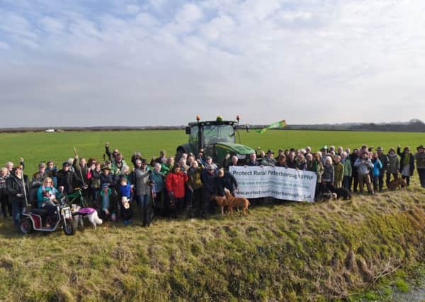 Castor, Ailsworth and Upton residents gather at the proposed development site 200meteres from Castor Hanglands EMN-170215-161941009