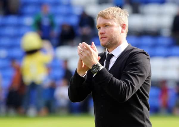 Posh manager Grant McCann applauds the home fans after a 2-1 win over Plymouth. Photo: Joe Dent/theposh.com.