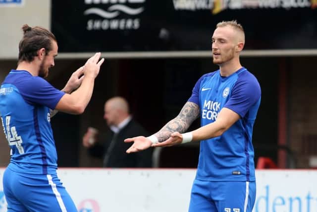 Marcus Maddison (right).