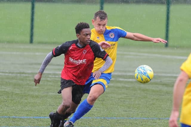 Hat-trick hero Erik Makate (red) in action against Stamford Lions. Photo: David Lowndes.
