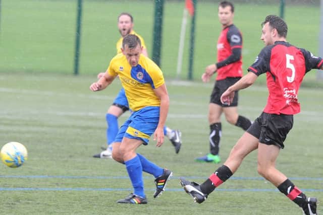 Netherton's Chris Hansford (5) plays the ball forward in the game against Stamford Lions at the Grange. Photo: David Lowndes.