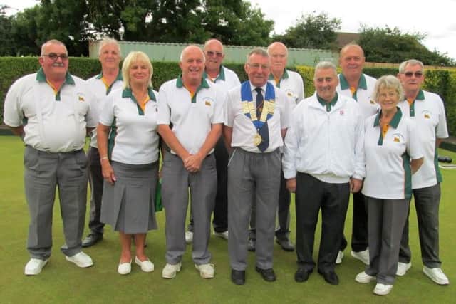 Rowlett Cup winners Peterborough & District with Peterborough League president Bruce Saint.  From the left are, back, Brian Bassam, Cliff Watson, Wilf Redhead, Mick Greaves, Ray Keating, front, Dave Corney, Wendy Stevens, Alec Emery, League president Bruce Saint, Jeff Clipston and Jenny Harvey.