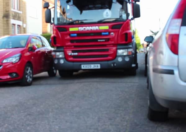 Fire engines struggle to pass parked cars in narrow streets
