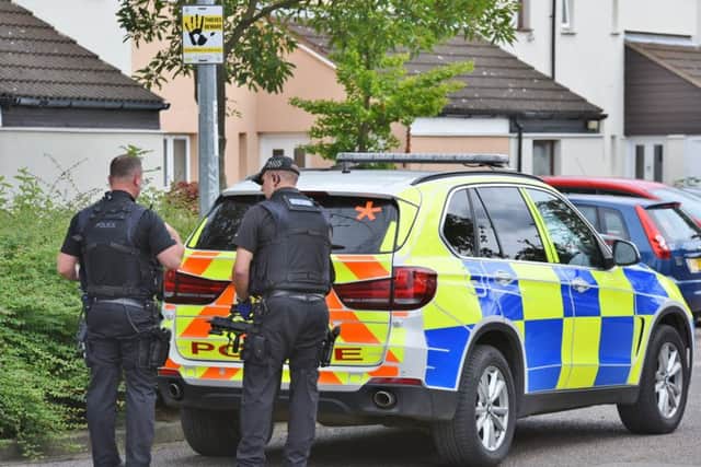 Armed police attend an incident at Sheepwalk, Paston EMN-170708-170451009