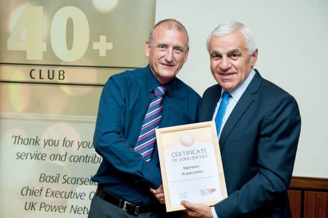 Nigel Green celebrating 40 years in the electricity industry alongside Basil Scarsella, chief executive at UK Power Networks