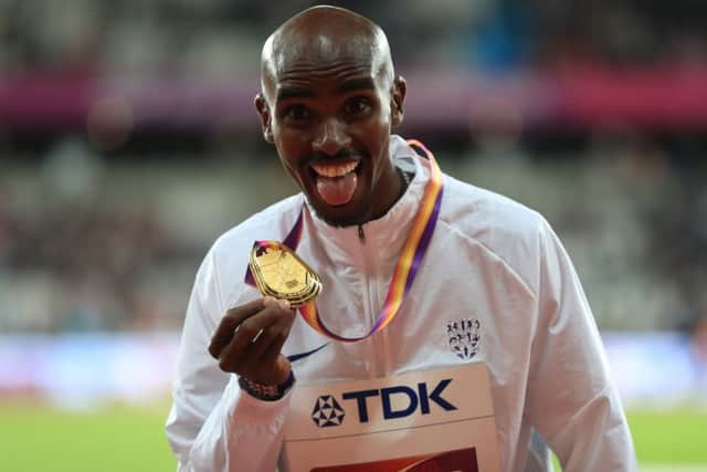 Mo Farah with his 10,000m gold medal from the World Championships in London.