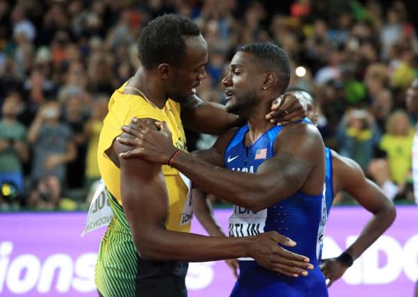 Usain Bolt (left) and Justin Gatlin embrace after the World 100m final in London.