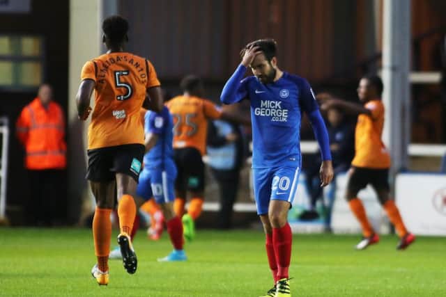 Posh midfielder Michael Doughty cuts a dejected figure as Barnet celebrate their second goal. Photo: Joe Dent/theposh.com.