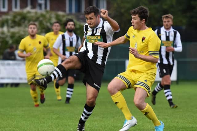 Craig Rook (stripes) in action for Peterborough Northern Star against Wellingborough Whitworth. Photo: Chantelle McDonald. @cmcdphotos