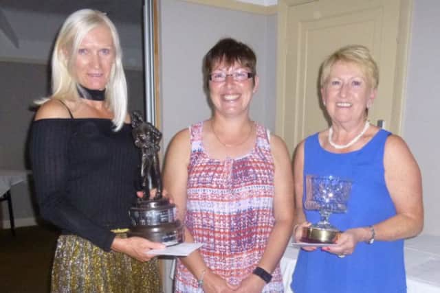 Nene Park Ladies club champion Denise Payne (left) and net competition winner Barbara Bird (right) received their trophies from captain Cath Hunt at a presentation evening at The Farmers, Yaxley, which followed the Lady Captain's Day competition.