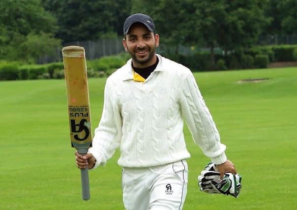 Adnan Latif after scoring 119 not out for Sheikh 11 against Warboys.