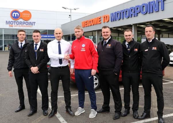 Grant McCann with Lee Watson and the Motorpoint Peterborough sales team.