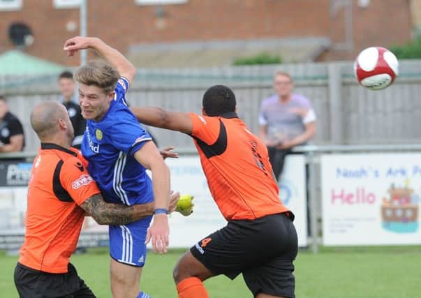 Two-goal Mark Jones (blue) in action for Peterborough Sports against Kidsgrove. Photo: David Lowndes.