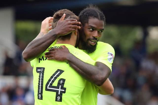 Posh midfielder Anthony Grant congratulates hat-trick hero Jack Marriott at Bristol Rovers. Photo: Joe Dent/theposh.com.