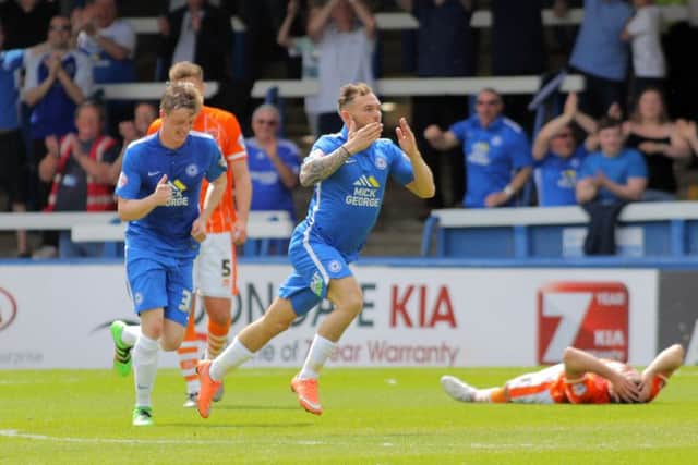 Jon Taylor celebrates a goal for his hat-trick against Posh against Blackpool in May, 2016.