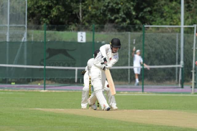 Nick Green of Market Deeping is trapped lbw by Connor Parnell of Peterborough Town. Photo: David Lowndes.