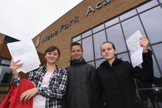 Nene Park Academy students Kevey Bow, Aleksander Wozniak and Paula Kaczmarczyk celebrate their results