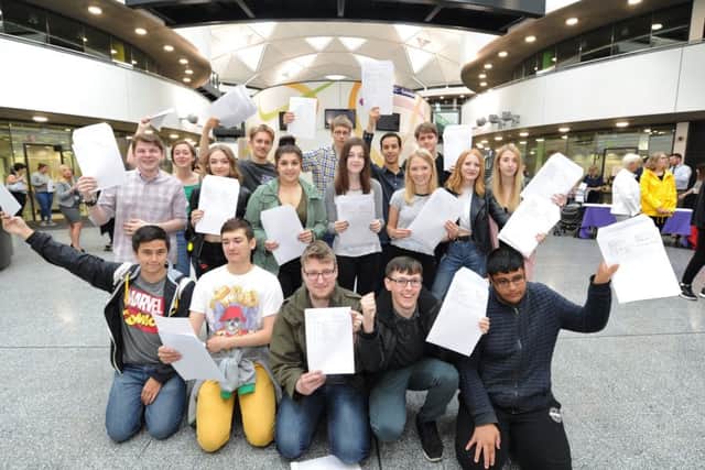 A Level Day at Thomas Deacon Academy. Some of the 6th formers with their results. EMN-170817-112743009