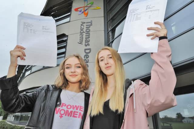 A Level Day at Thomas Deacon Academy. Some of the 6th formers with their results. Misha Folker A*AA and Maddy Wallace A*AA EMN-170817-112707009