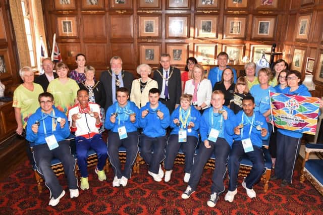 Mayor of Peterborough Coun. John Fox and Mayoress Judy Fox joining athletics ,and coaches,    who won medals at the recent Special Olympics at Sheffield at a reception at the Mayor's Parlour. EMN-171209-163823009