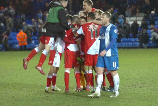 Kidderminster celebrate victory over Posh in the FA Cup in 2014.
