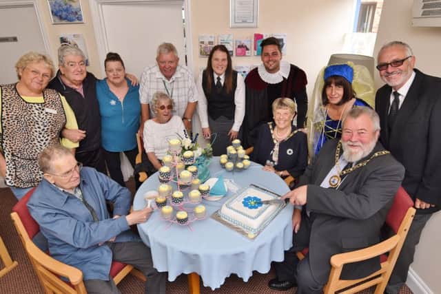 Mayor of Peterborough Coun. John Fox and Mayoress Judy Fox at the opening of the Forget Me Not Cafe at Tudors Care Home in Stanground. Also pictured are staff and residents. EMN-170830-112150009
