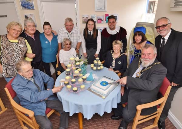 Mayor of Peterborough Coun. John Fox and Mayoress Judy Fox at the opening of the Forget Me Not Cafe at Tudors Care Home in Stanground. Also pictured are staff and residents. EMN-170830-112150009