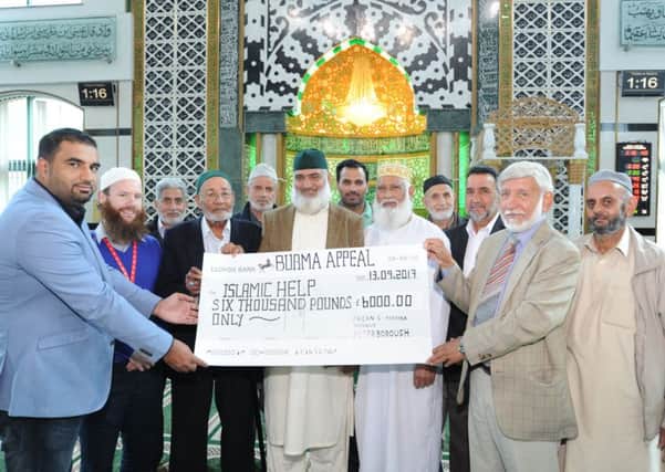 Cheque presentation to representatives from  Islamic Help,   for Rohingya refugees from Myanmar , from  Chairman Abdul Muquaddas Choudhuri  and officials of  Faizan-e-Madina Mosque EMN-170913-152620009