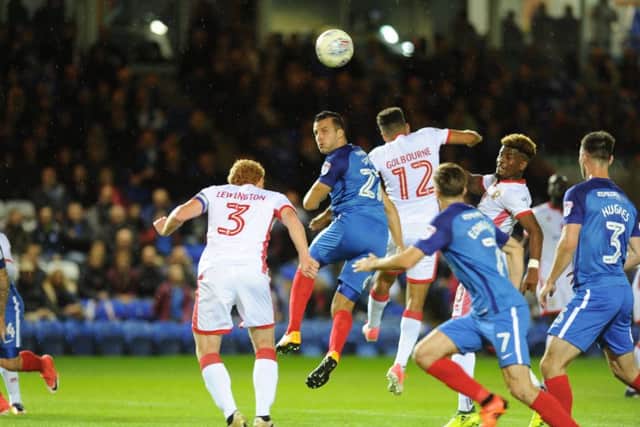Steven Taylor (facing) was a great help to Liam Shephard on his Posh debut. Photo: David Lowndes.