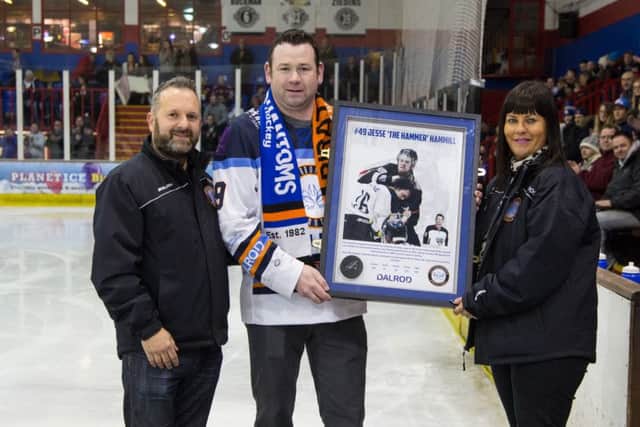 Phantoms owners Dave and Jo Lane either side of former player Jesse Hammill.