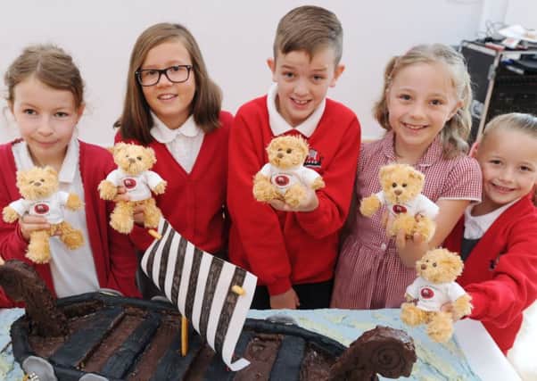 Hertiage Park primary school celebrates  its twenty years since opening. Two giants birthday cakes  for the pupils. Pictured are  Nikola Surdy, Mollie Mather, Tyler Jawojsz, Ellie Garner and Freya Pinfold EMN-170809-144621009