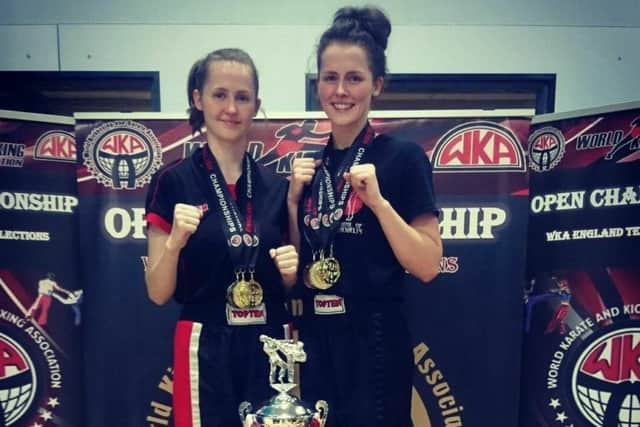 Bethany Jones and Rebecca Jones with their trophy haul from the WKA Open.