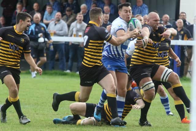 Kaz Henderson is about to score a try for Lions against Derby. Photo: Mick Sutterby.