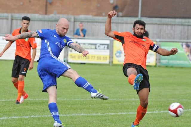 Lewis Webb of Peterborough Sports in action.