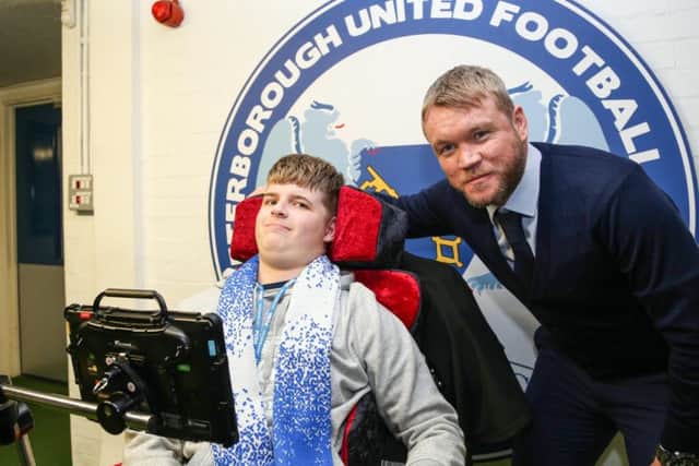 Peterborough United Manager Grant McCann with Ryley before the game